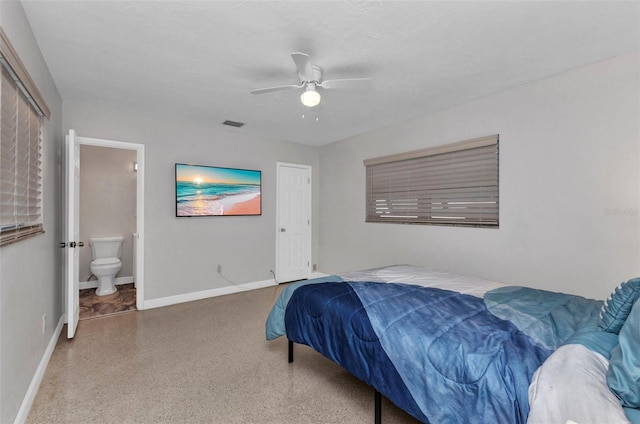 4244 Harbor Blvd, Port Charlotte, FL 33952 - bedroom with speckle patterned floor, ensuite bath, and ceiling fan