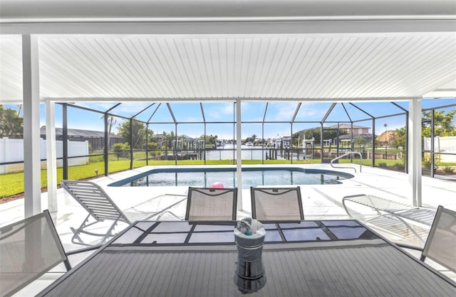 4244 Harbor Blvd, Port Charlotte, FL 33952 - outdoor pool featuring a patio area, glass enclosure, and a water view