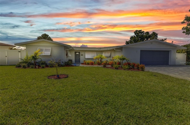 4244 Harbor Blvd, Port Charlotte, FL 33952 - ranch-style home featuring stucco siding, an attached garage, decorative driveway, and a gate