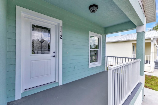 419 Carmalita St, Punta Gorda, FL 33950 - doorway to property featuring a porch