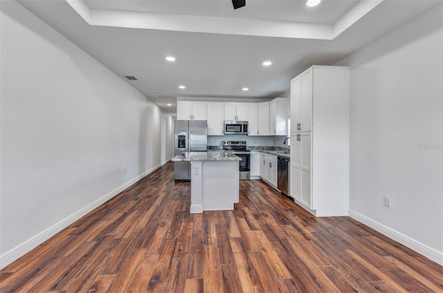 419 Carmalita St, Punta Gorda, FL 33950 - kitchen featuring stainless steel appliances, a center island, dark wood finished floors, white cabinetry, and recessed lighting