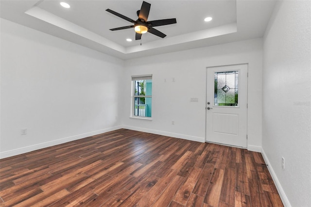 419 Carmalita St, Punta Gorda, FL 33950 - foyer entrance with a tray ceiling, dark wood-style floors, recessed lighting, and ceiling fan