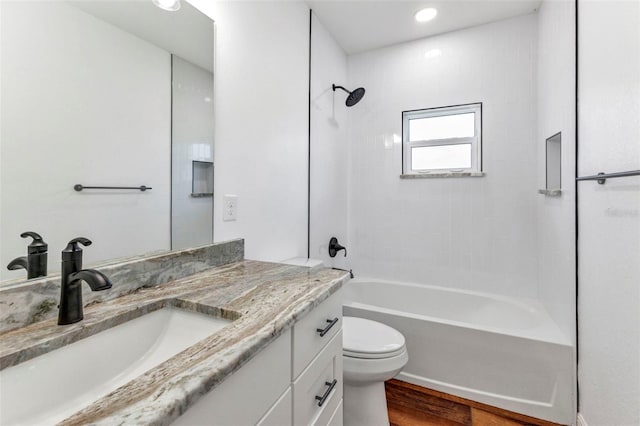 419 Carmalita St, Punta Gorda, FL 33950 - full bath featuring vanity, shower / washtub combination, wood finished floors, and recessed lighting