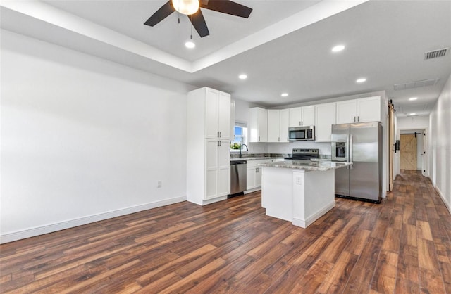 419 Carmalita St, Punta Gorda, FL 33950 - kitchen with appliances with stainless steel finishes, dark wood finished floors, white cabinetry, ceiling fan, and recessed lighting