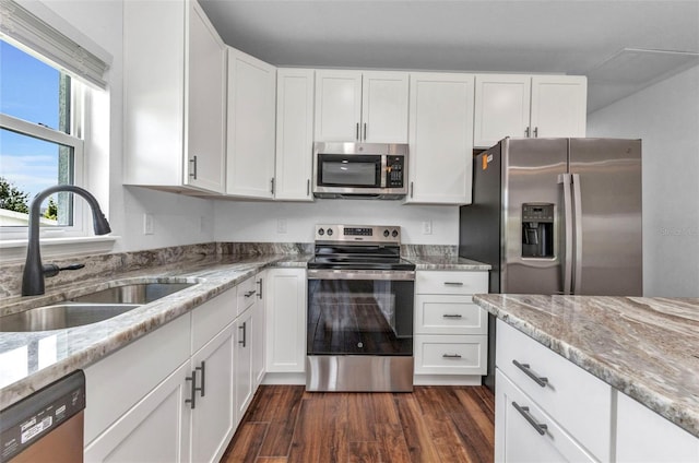 419 Carmalita St, Punta Gorda, FL 33950 - kitchen featuring appliances with stainless steel finishes, light stone counters, and white cabinets