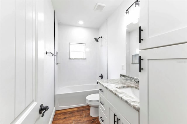 419 Carmalita St, Punta Gorda, FL 33950 - bathroom featuring vanity, wood finished floors, shower / bathtub combination, and recessed lighting