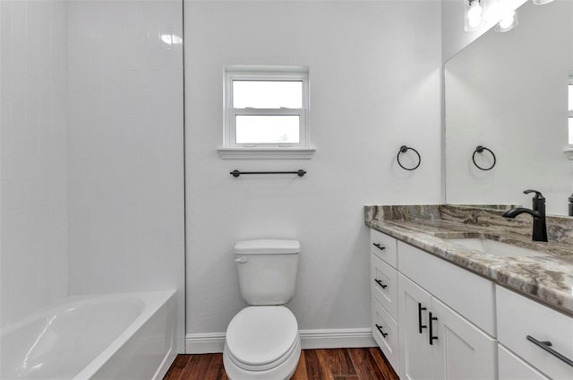 419 Carmalita St, Punta Gorda, FL 33950 - full bath featuring vanity, wood finished floors, and shower / tub combination