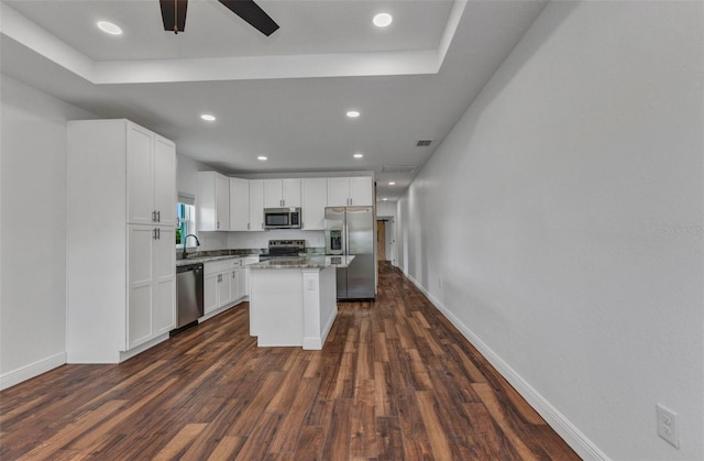 419 Carmalita St, Punta Gorda, FL 33950 - kitchen with appliances with stainless steel finishes, dark wood-style flooring, ceiling fan, white cabinets, and recessed lighting