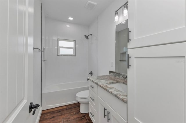 419 Carmalita St, Punta Gorda, FL 33950 - bathroom featuring vanity, washtub / shower combination, wood finished floors, and recessed lighting