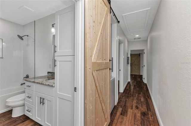 419 Carmalita St, Punta Gorda, FL 33950 - hallway featuring dark wood finished floors and attic access