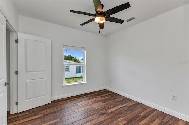 419 Carmalita St, Punta Gorda, FL 33950 - unfurnished room with dark wood-type flooring and a ceiling fan