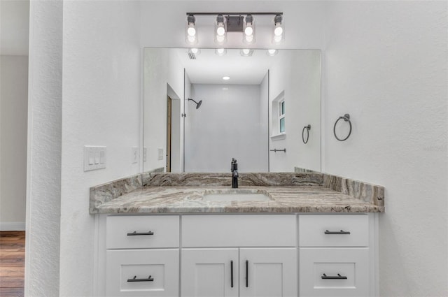 419 Carmalita St, Punta Gorda, FL 33950 - bathroom with vanity and wood finished floors