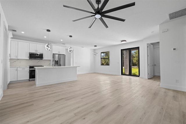 17156 Eugene Ave, Port Charlotte, FL 33954 - unfurnished living room featuring recessed lighting, a ceiling fan, and light wood-style floors