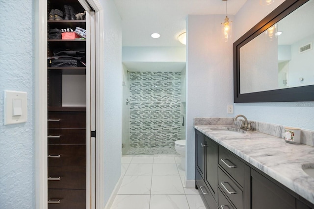 2309 Conway Blvd, Port Charlotte, FL 33952 - bathroom with a shower stall, double vanity, marble look tiles, and a spacious closet