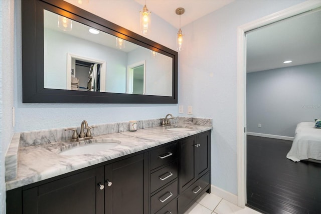 2309 Conway Blvd, Port Charlotte, FL 33952 - ensuite bathroom featuring double vanity and tile patterned flooring
