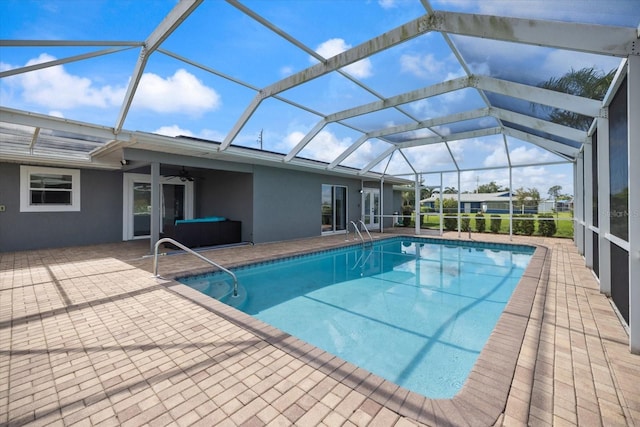 2309 Conway Blvd, Port Charlotte, FL 33952 - swimming pool with a ceiling fan, a patio area, and glass enclosure