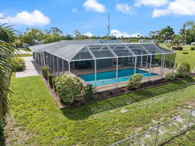 2309 Conway Blvd, Port Charlotte, FL 33952 - swimming pool with a lawn, a patio area, and glass enclosure
