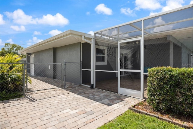 2309 Conway Blvd, Port Charlotte, FL 33952 - rear view of house featuring a gate and stucco siding