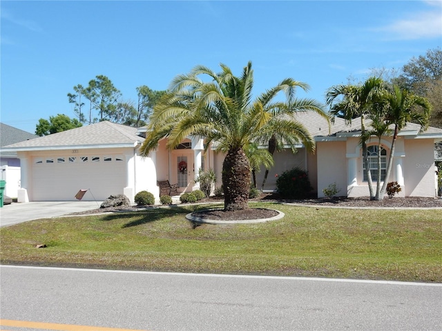 388 Orlando Blvd, Port Charlotte, FL 33954 - ranch-style house featuring stucco siding, concrete driveway, an attached garage, and a front yard