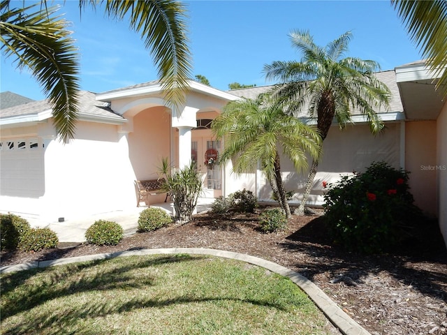 388 Orlando Blvd, Port Charlotte, FL 33954 - view of front of home with stucco siding and a garage