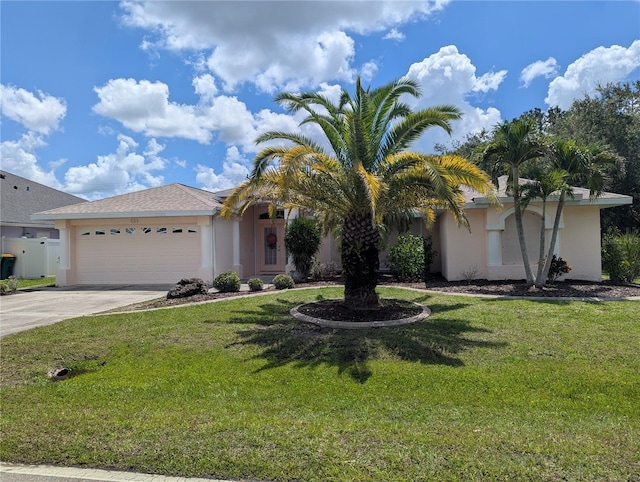 388 Orlando Blvd, Port Charlotte, FL 33954 - view of front of house with stucco siding, an attached garage, driveway, and a front yard