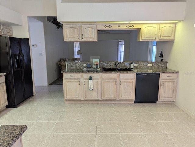 388 Orlando Blvd, Port Charlotte, FL 33954 - kitchen with black appliances and light brown cabinets