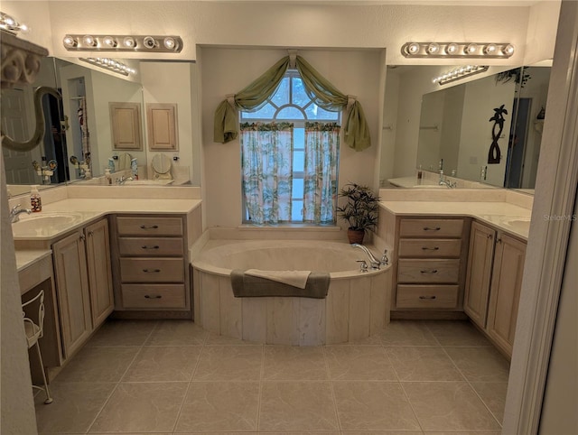 388 Orlando Blvd, Port Charlotte, FL 33954 - bathroom with two vanities, a garden tub, and tile patterned floors