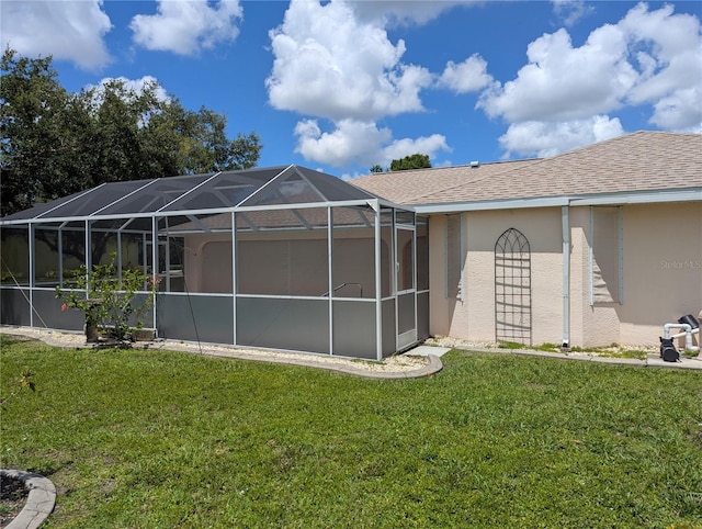 388 Orlando Blvd, Port Charlotte, FL 33954 - back of house featuring a yard, stucco siding, and a lanai