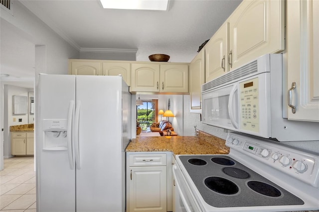 3221 White Ibis Ct Unit D1, Punta Gorda, FL 33950 - kitchen featuring white appliances, crown molding, light tile patterned flooring, and cream cabinets