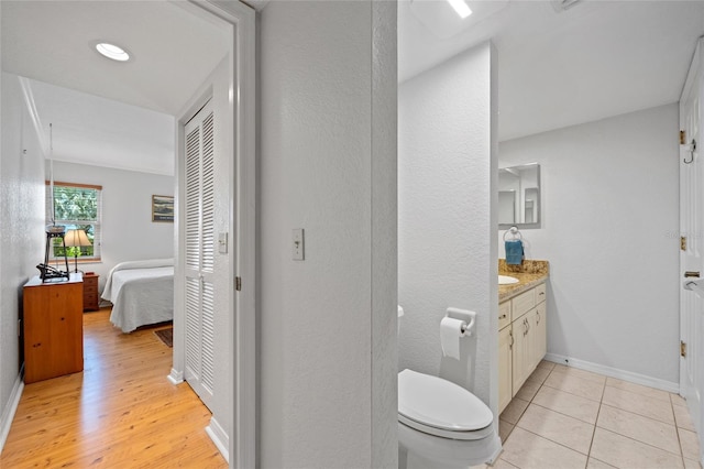 3221 White Ibis Ct Unit D1, Punta Gorda, FL 33950 - bathroom with vanity, ensuite bath, and wood finished floors