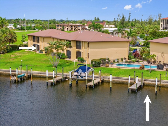 3221 White Ibis Ct Unit D1, Punta Gorda, FL 33950 - rear view of house featuring a water view, an outdoor pool, and stucco siding