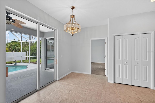 1762 Mincey Ter, North Port, FL 34286 - unfurnished dining area with ceiling fan, light tile patterned floors, and a chandelier