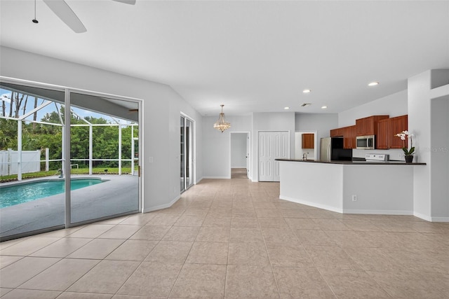 1762 Mincey Ter, North Port, FL 34286 - unfurnished living room with recessed lighting, a chandelier, a ceiling fan, and light tile patterned flooring