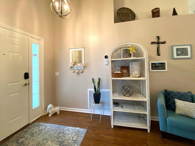 24132 Buckingham Way, Punta Gorda, FL 33980 - foyer entrance with wood finished floors and a chandelier