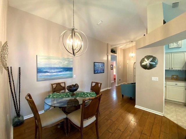 24132 Buckingham Way, Punta Gorda, FL 33980 - dining space with wood-type flooring and a chandelier