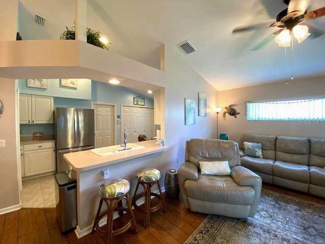 24132 Buckingham Way, Punta Gorda, FL 33980 - living room featuring hardwood / wood-style floors, ceiling fan, and high vaulted ceiling