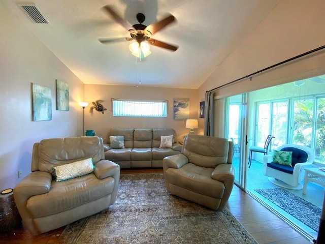 24132 Buckingham Way, Punta Gorda, FL 33980 - living room featuring lofted ceiling, wood finished floors, and a ceiling fan