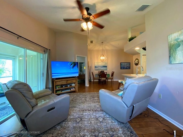 24132 Buckingham Way, Punta Gorda, FL 33980 - living area featuring a ceiling fan and wood finished floors