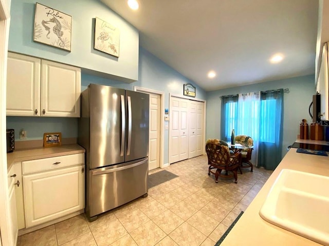 24132 Buckingham Way, Punta Gorda, FL 33980 - kitchen featuring stainless steel appliances, lofted ceiling, light countertops, light tile patterned floors, and recessed lighting