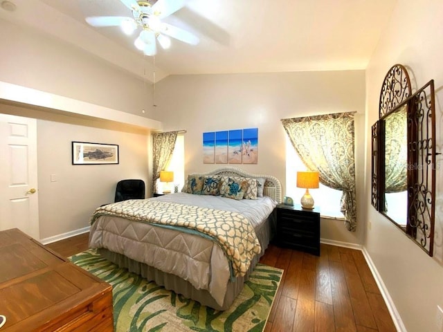 24132 Buckingham Way, Punta Gorda, FL 33980 - bedroom with vaulted ceiling, dark wood-style flooring, and ceiling fan