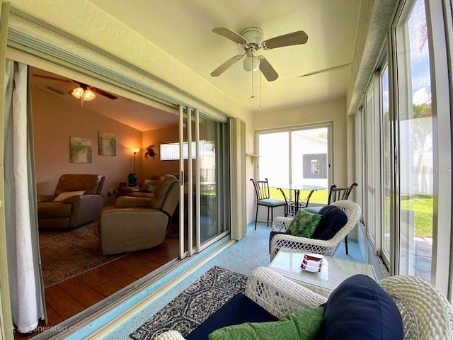 24132 Buckingham Way, Punta Gorda, FL 33980 - sunroom / solarium featuring plenty of natural light, lofted ceiling, and wood finished floors