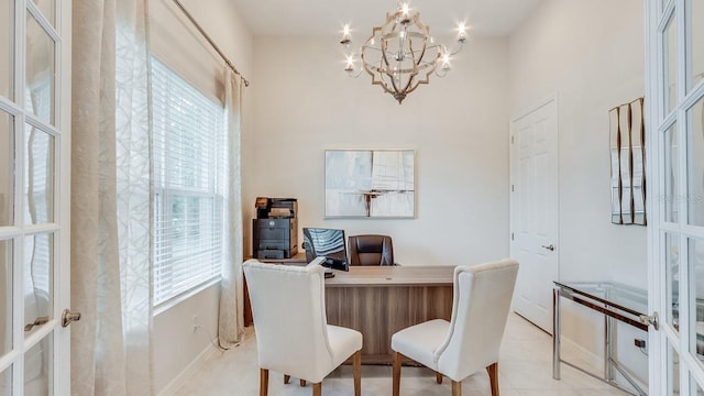 2308 Oberon Ln, Punta Gorda, FL 33983 - home office featuring healthy amount of natural light, french doors, a chandelier, and light tile patterned floors