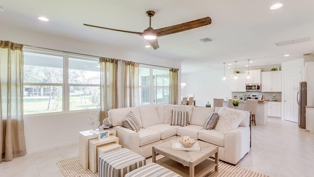 2308 Oberon Ln, Punta Gorda, FL 33983 - living area featuring healthy amount of natural light, light tile patterned floors, recessed lighting, and a ceiling fan
