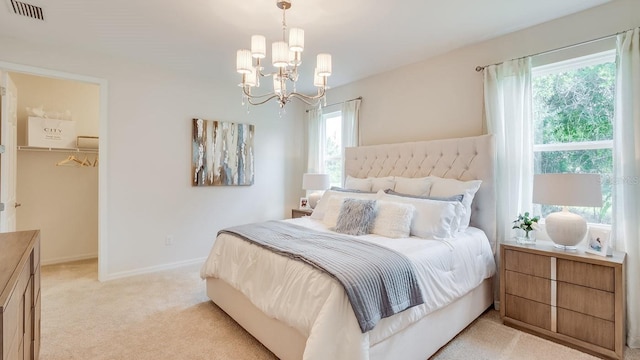 2308 Oberon Ln, Punta Gorda, FL 33983 - bedroom featuring light carpet, a chandelier, and a spacious closet