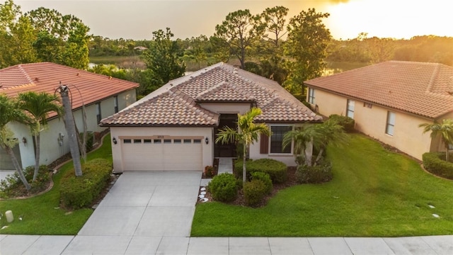 2712 Arugula Dr, North Port, FL 34289 - mediterranean / spanish home with an attached garage, driveway, a tile roof, stucco siding, and a front yard
