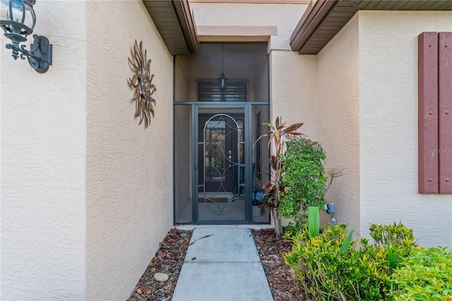 2712 Arugula Dr, North Port, FL 34289 - property entrance with stucco siding