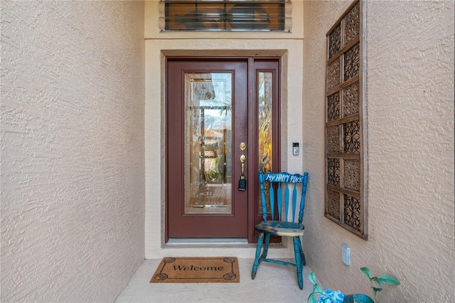 2712 Arugula Dr, North Port, FL 34289 - property entrance with stucco siding