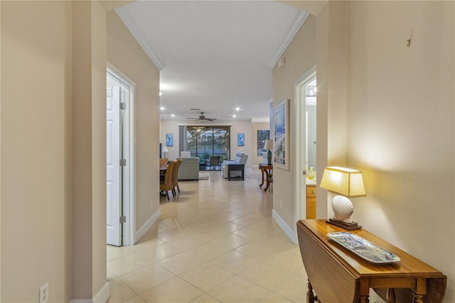 2712 Arugula Dr, North Port, FL 34289 - hallway featuring light tile patterned floors, ornamental molding, and recessed lighting