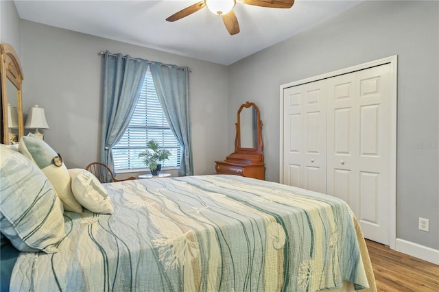 2712 Arugula Dr, North Port, FL 34289 - bedroom with wood finished floors, a closet, and a ceiling fan