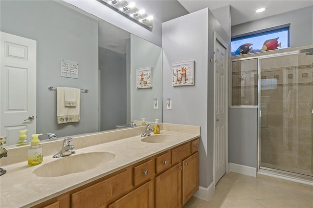 2712 Arugula Dr, North Port, FL 34289 - full bath with tile patterned floors, a shower stall, and double vanity